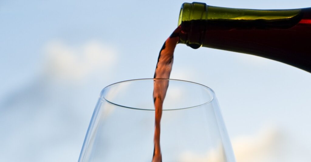 Pouring a glass of red wine