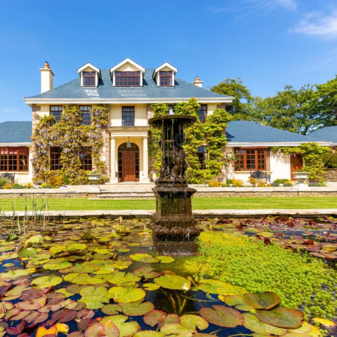 pond with luxury rental home