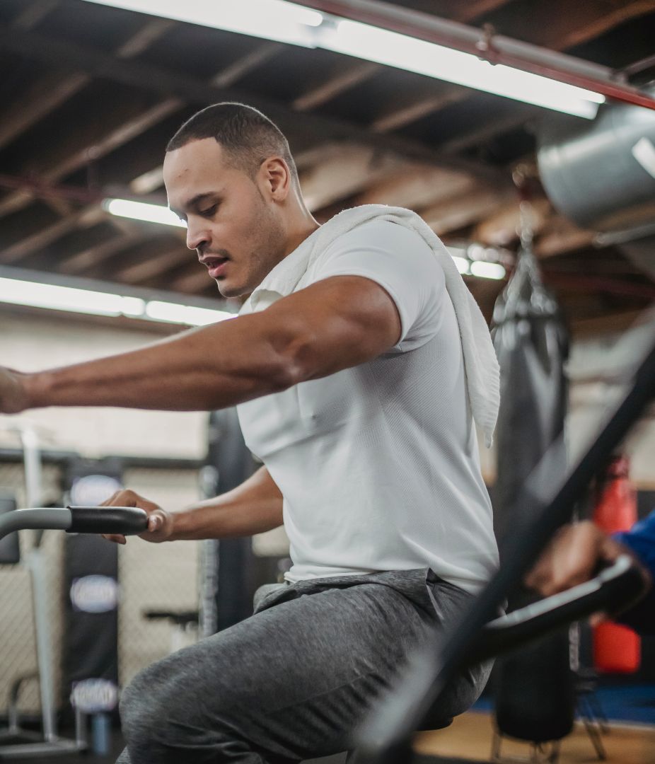 man using exercise bike