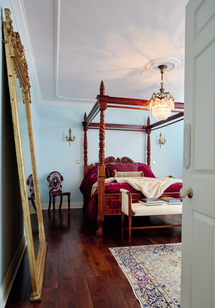 bedroom with a four poster bed