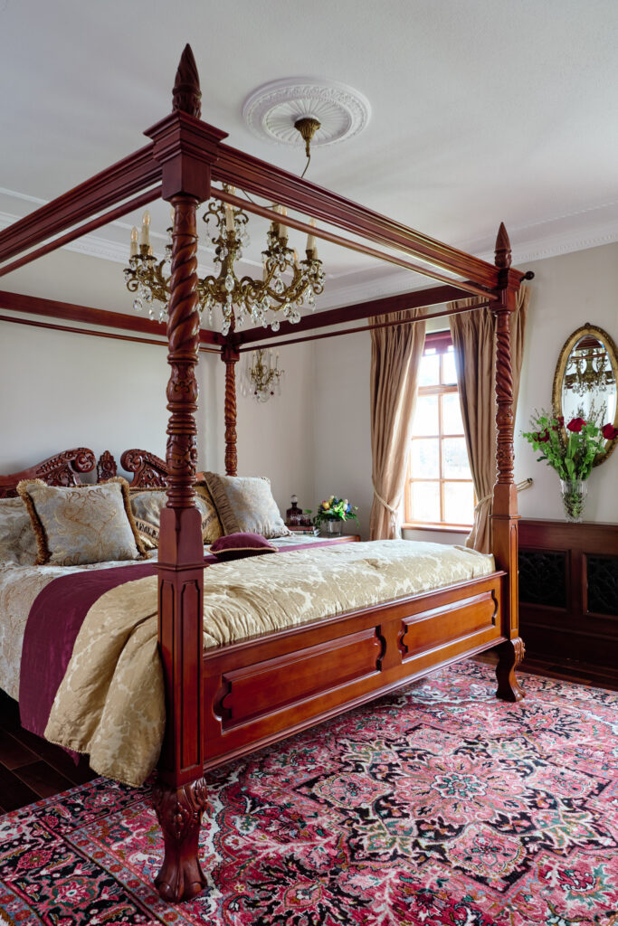 bedroom with a four poster bed