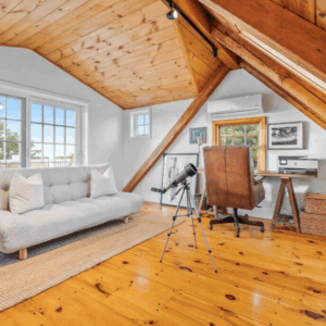 A telescope in a loft room